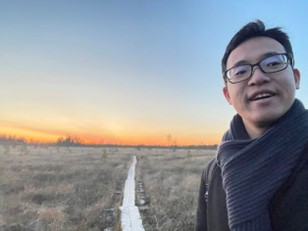 Takumi Okuno hiking in Arctic circle hiking area with sunset