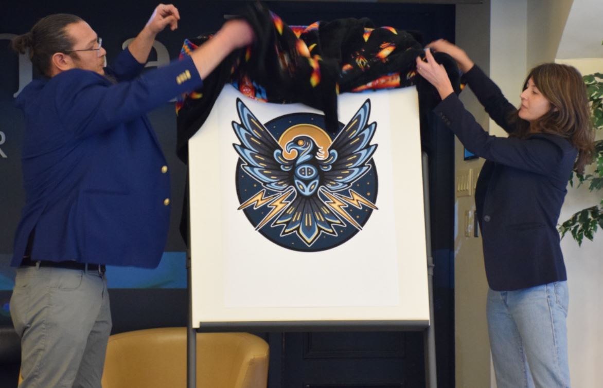Co-Directors Robin Sutherland, left, and Larissa Speak unveiled the Institute's new logo, a Thunderbird.