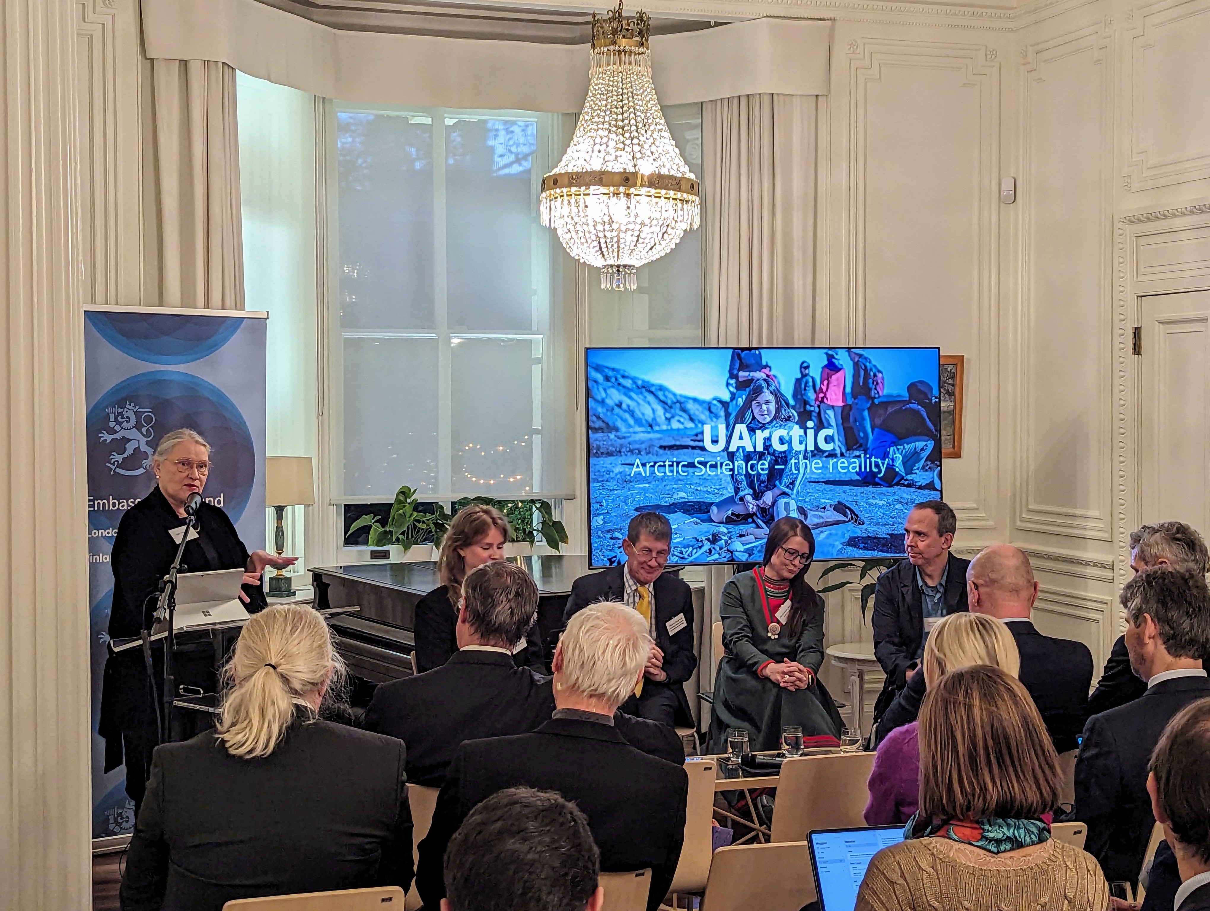 Panel discussion at the event at the Finnish Ambassador's Residence in London, November 21, 2023. Moderator on the podium: Outi Snellman. Panelists from left to right: Anni Pokela, Shaun Fitzgerald, Åsa Larsson Blind, Keith Larson. 